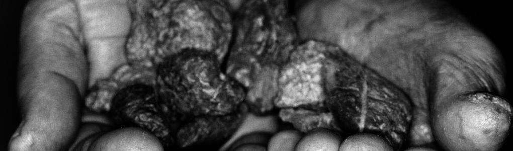 hands holding minerals